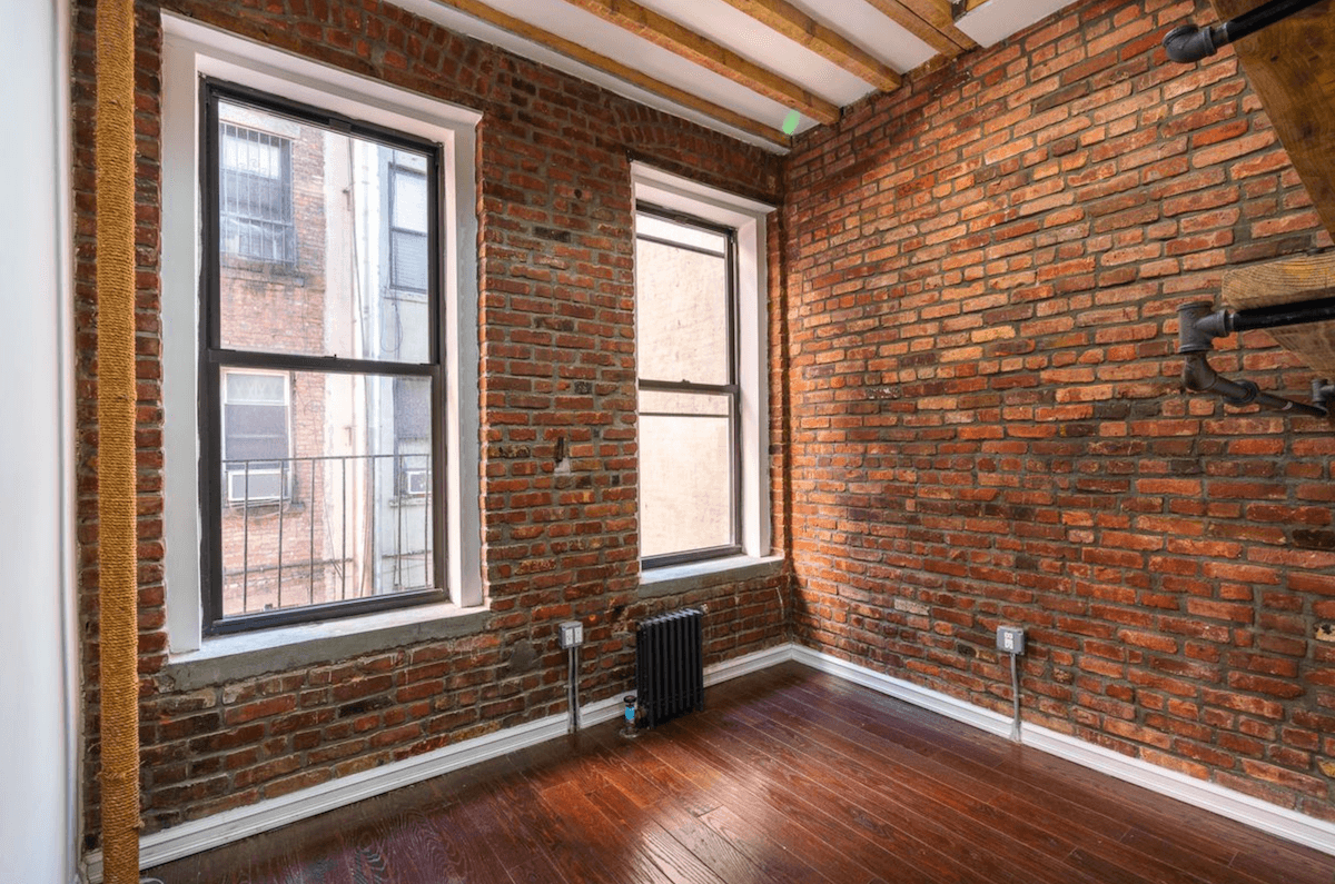 Want exposed brick? There’s plenty of it in this Chinatown two bedroom, for $2,975