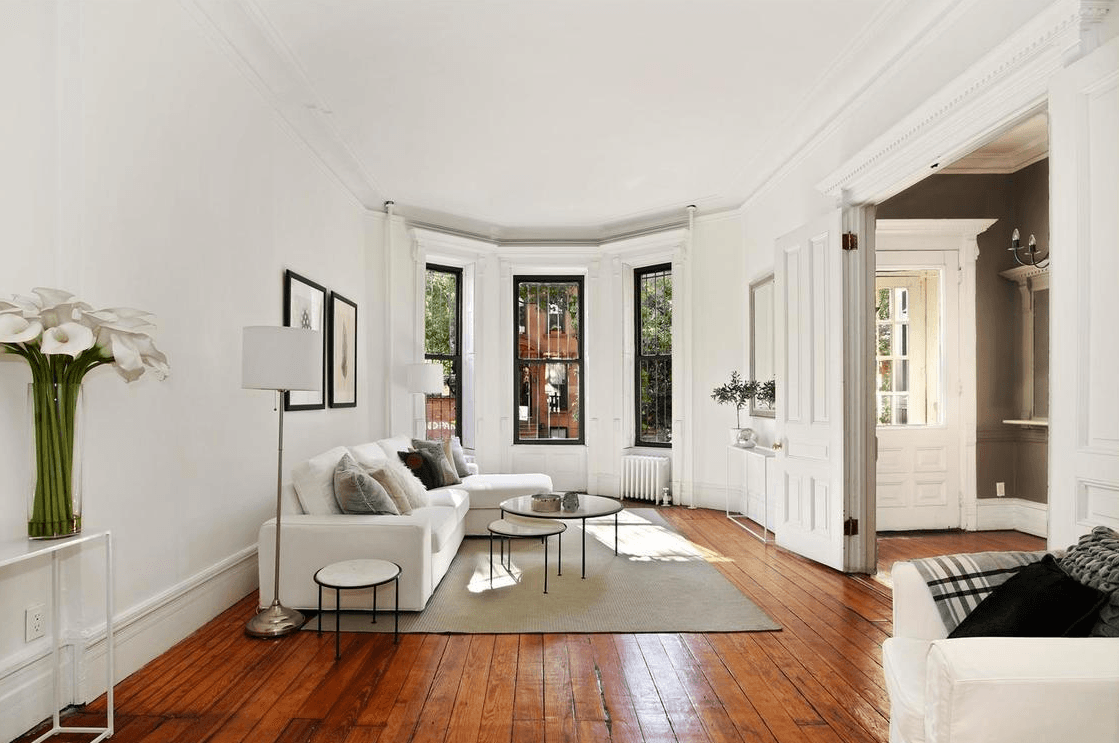 This three-story Park Slope townhouse comes with a garden-level rental unit