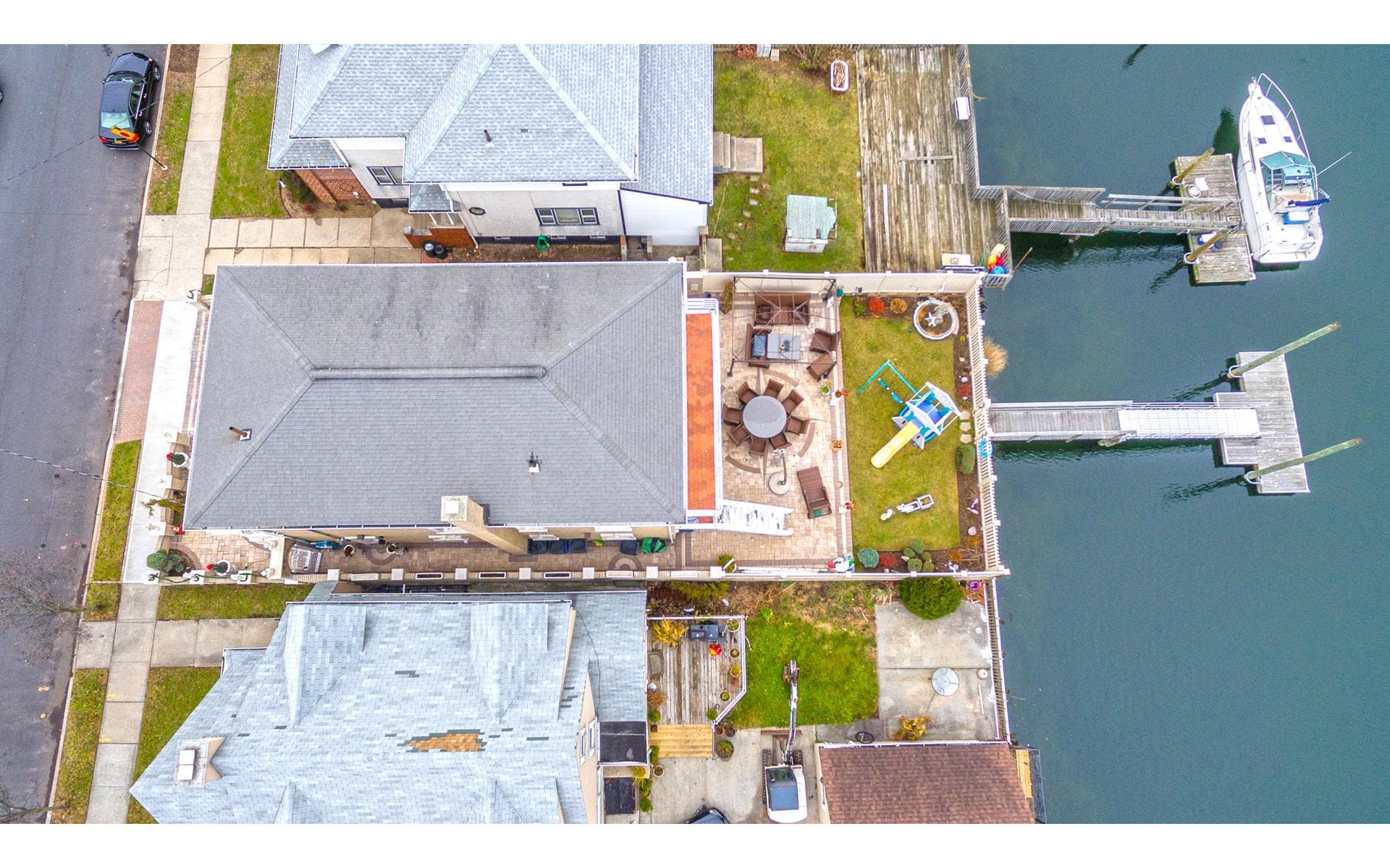 This Queens mini-mansion comes with a private dock