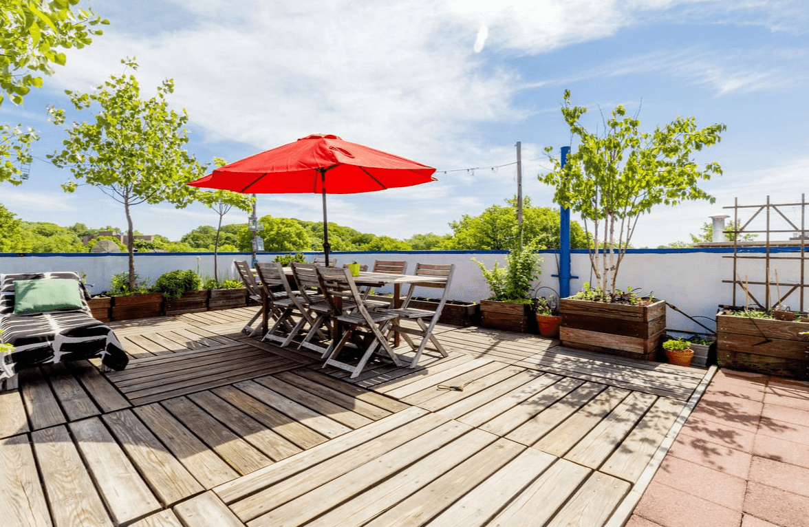 You could spend the summer on this two bedroom's massive roof deck