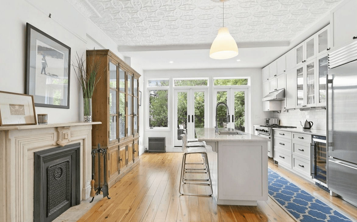 This South Slope townhouse has nice upgrades and charming details, plus a rental apartment