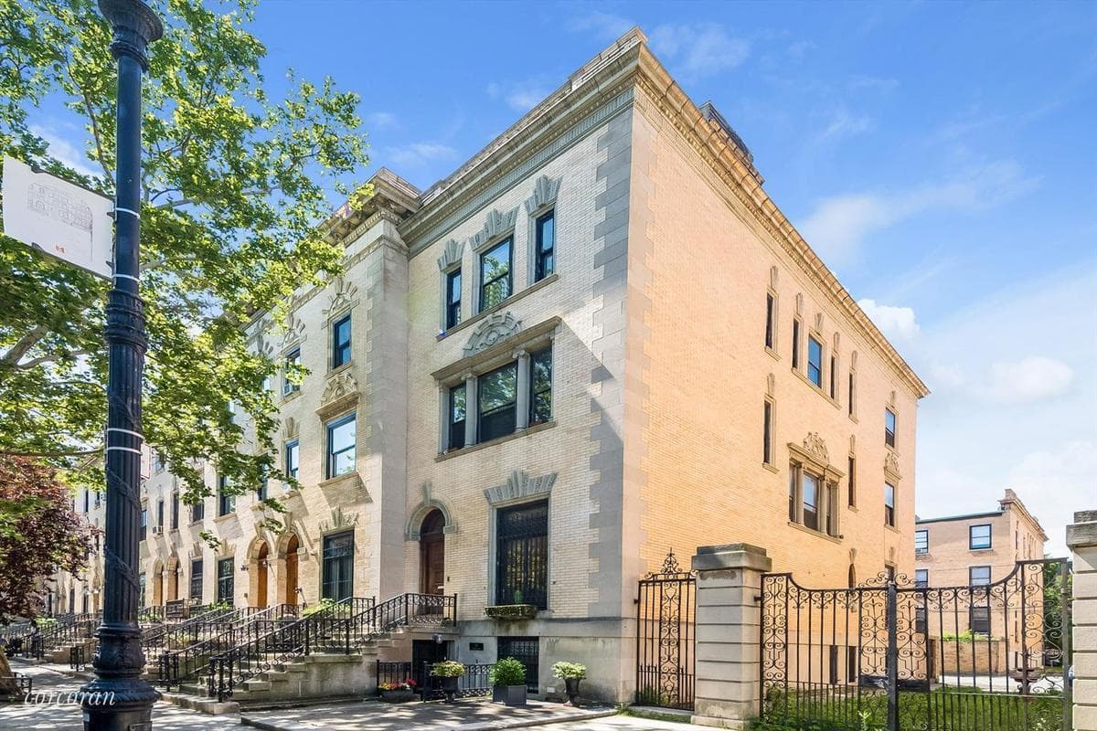 This Strivers' Row townhouse is on a corner lot and has parking for all your cars