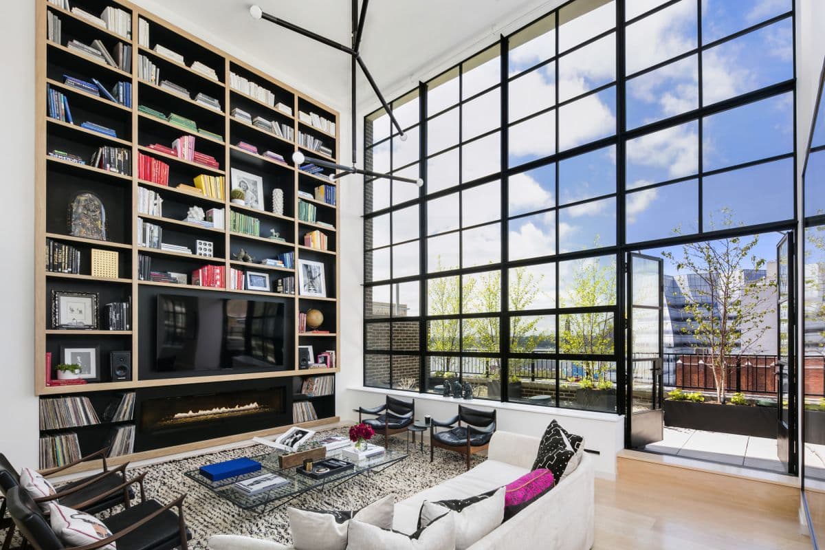 This Chelsea duplex penthouse boasts a wall of windows and a wraparound balcony 