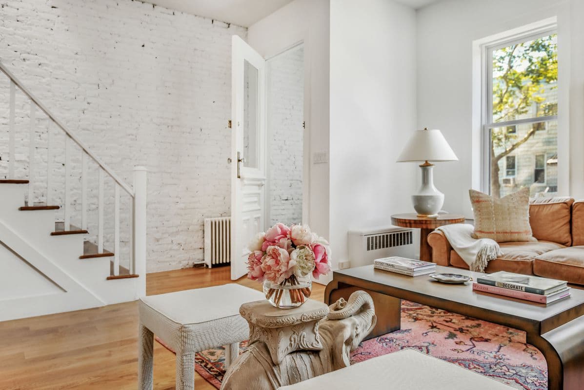 This three-bedroom Greenwood townhouse comes with a yard, a deck, and a rental unit