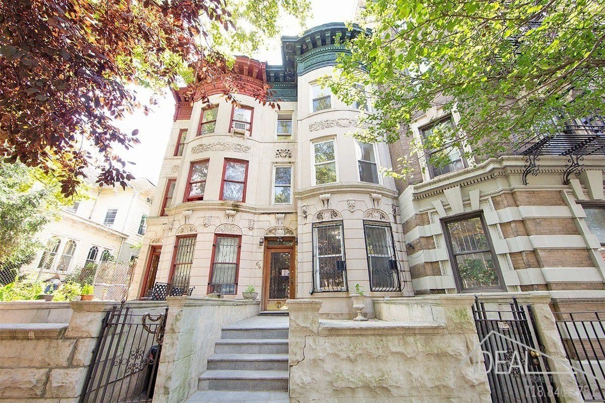 This Clinton Hill two-family limestone has historic details and a rental apartment, but probably no 'whispering trees'