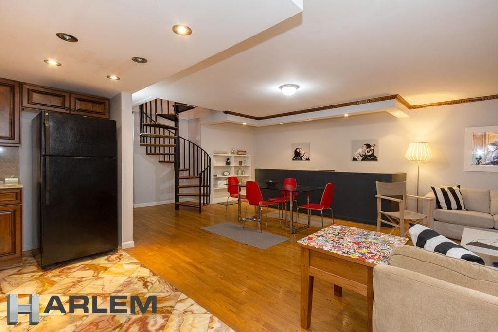 A modern townhouse in Harlem with triplex living and a rental income, but it must be owner occupied