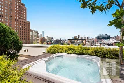 Outdoor hot tubs that provide the ultimate reason to don a bathing suit in the dead of winter