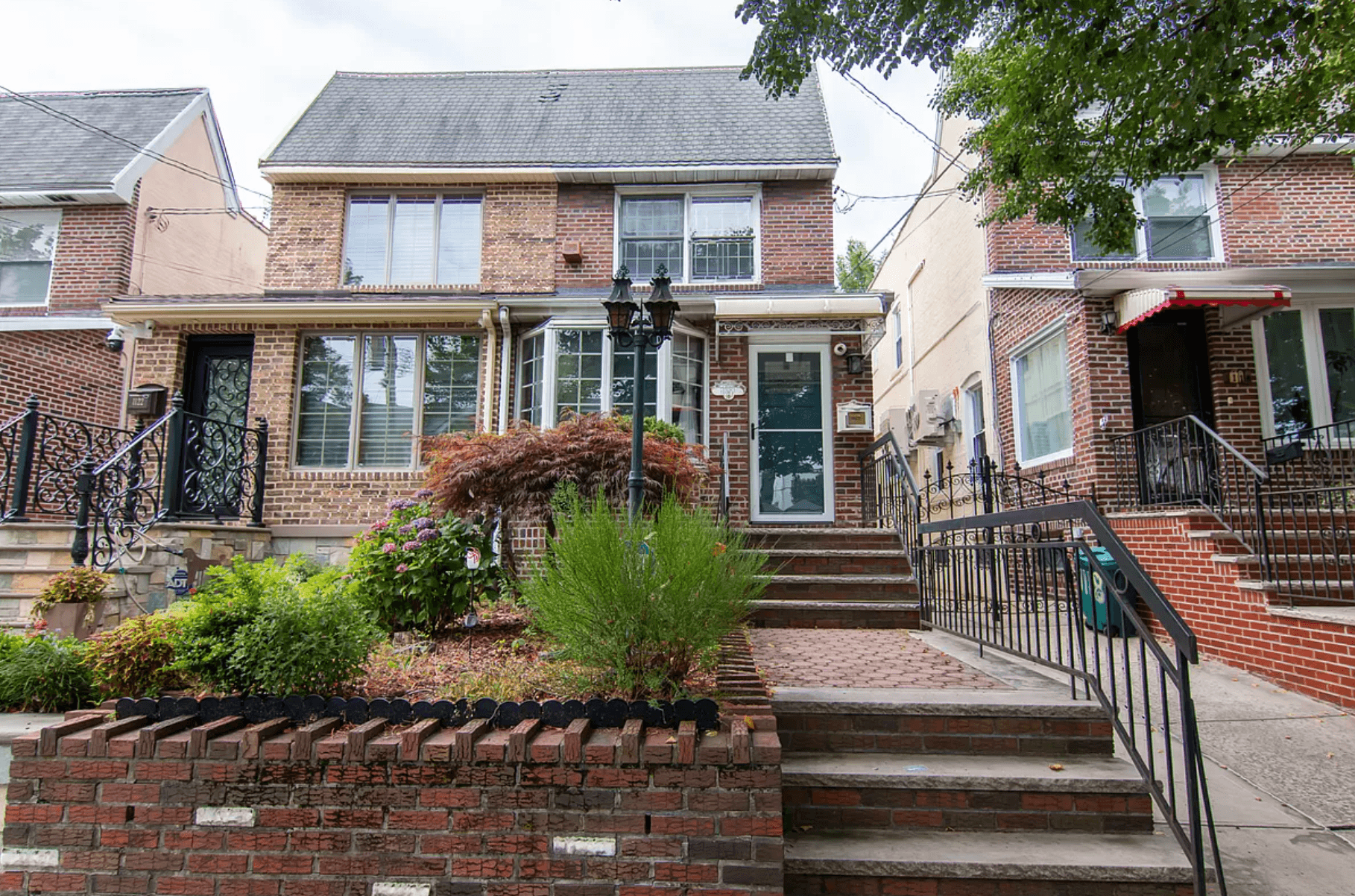 What to know about buying in Dyker Heights, Brooklyn, where many suburban-style houses have garages and even pools