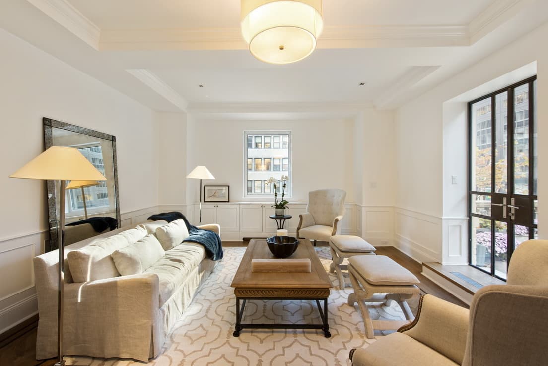 I mostly live abroad nowadays. Can my co-op board charge me extra for doing so?