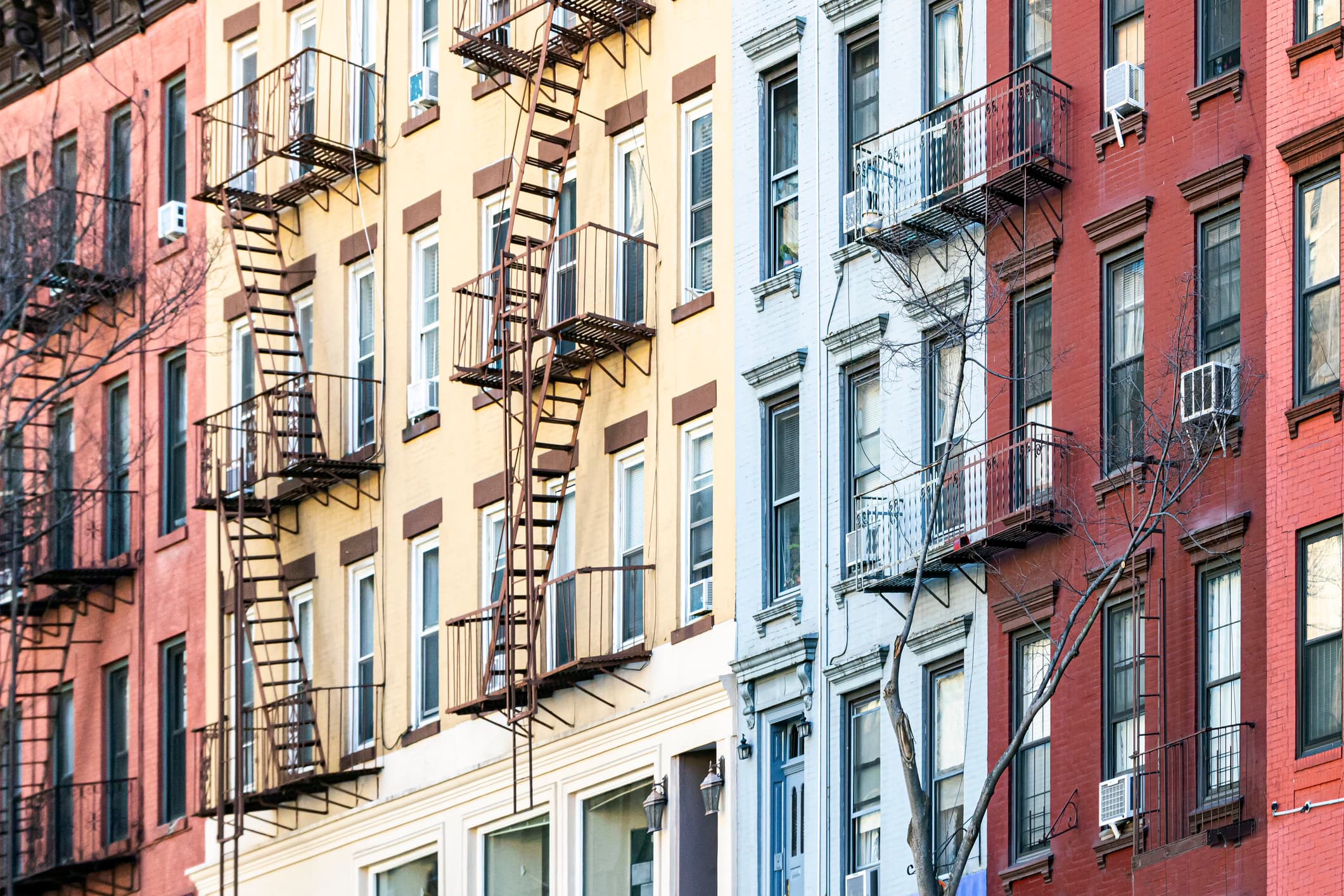 Block of colorful old apartment buildings in the Alphabet City neighborhood of Manhattan in New York City NYC