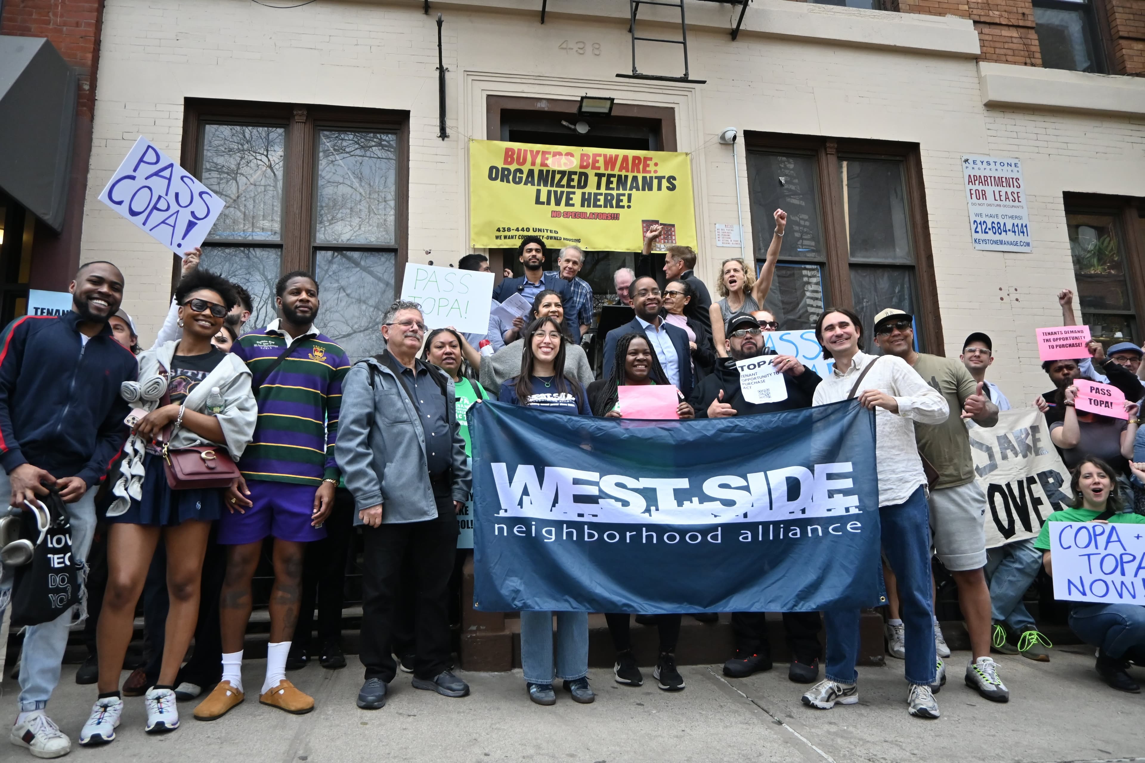 Tenants of 438 and 440 West 45th Street gathered on the stoop of the apartment building at 438.