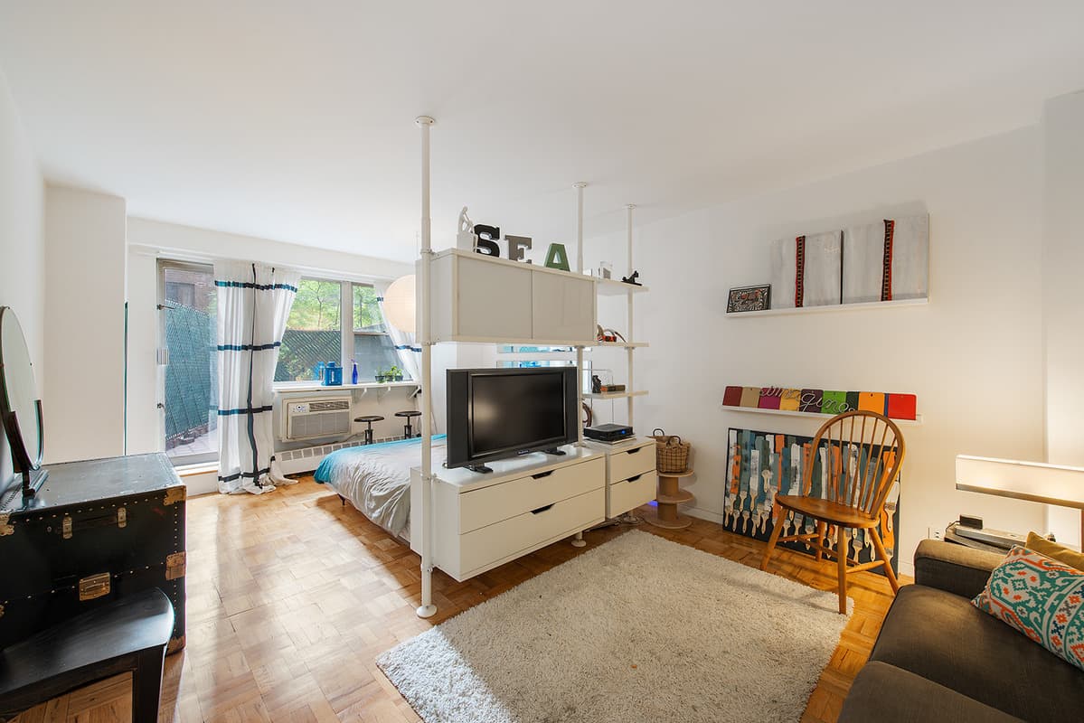 A Yorkville studio squeezes three rooms into one