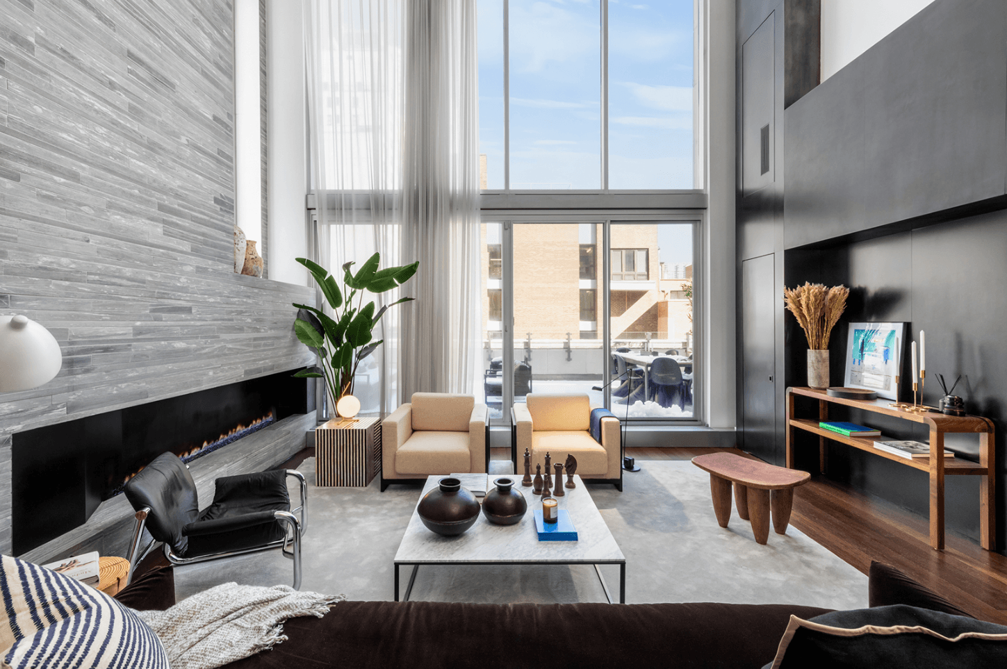 An UES triplex penthouse with an abundance of stone, steel, and glass, for $5,750,000