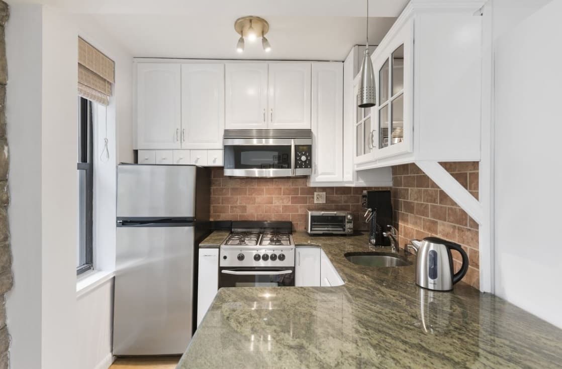 This $415,000 Midtown studio has a spacious kitchen and a laid-back co-op board