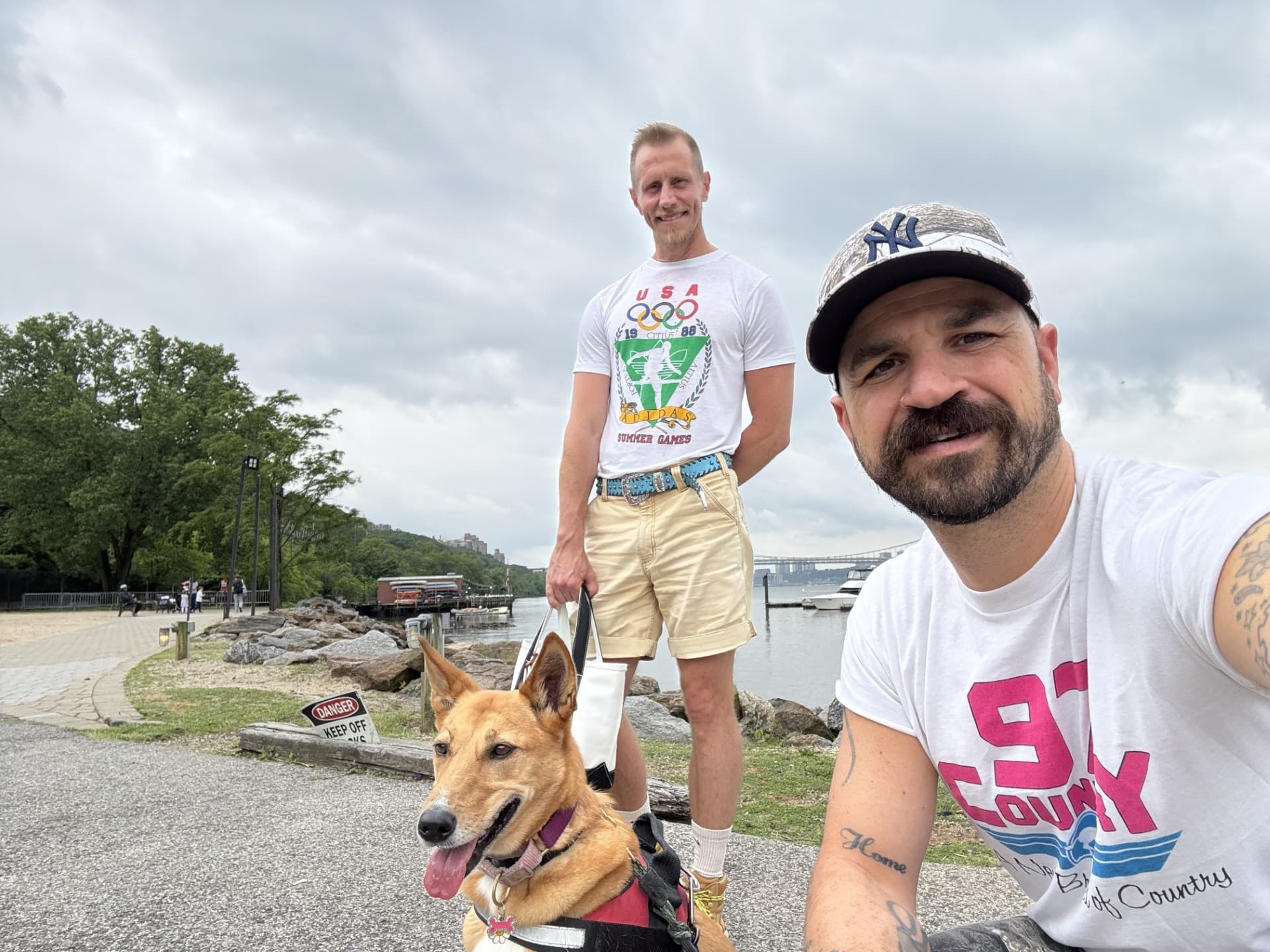 Paul Passavant and Matthew Conley with their pup, Sting Rae.