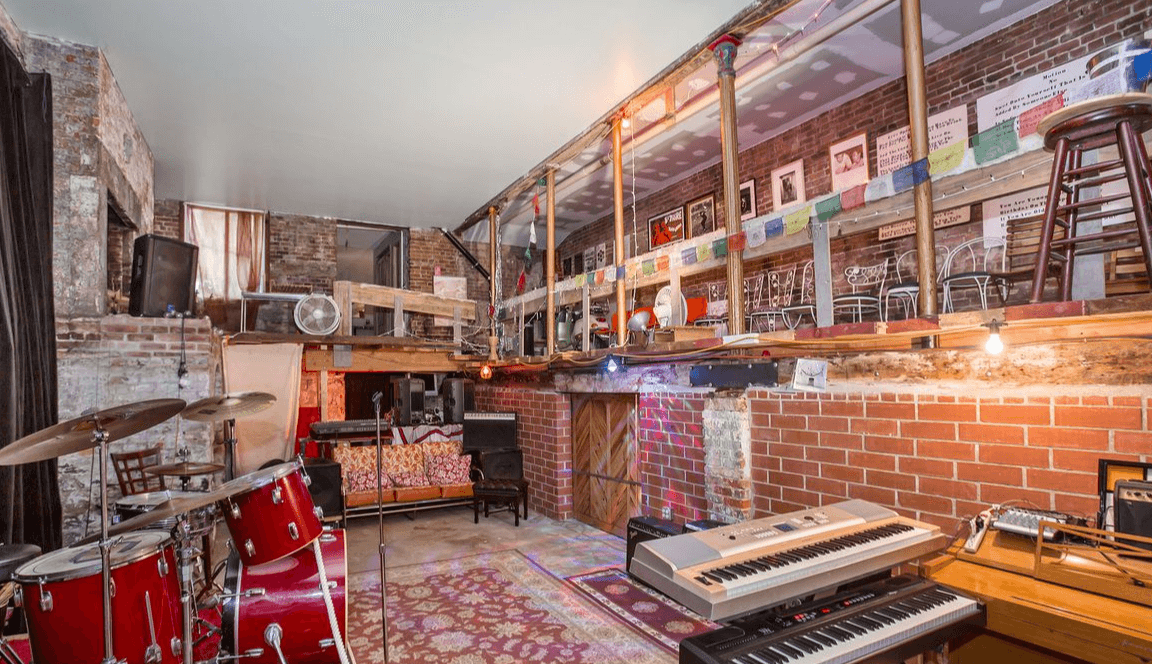 This East Village townhouse comes with tons of room, including a performance space