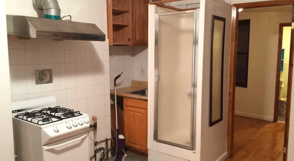The infamous "shower in the kitchen" apartment is actually adorable now