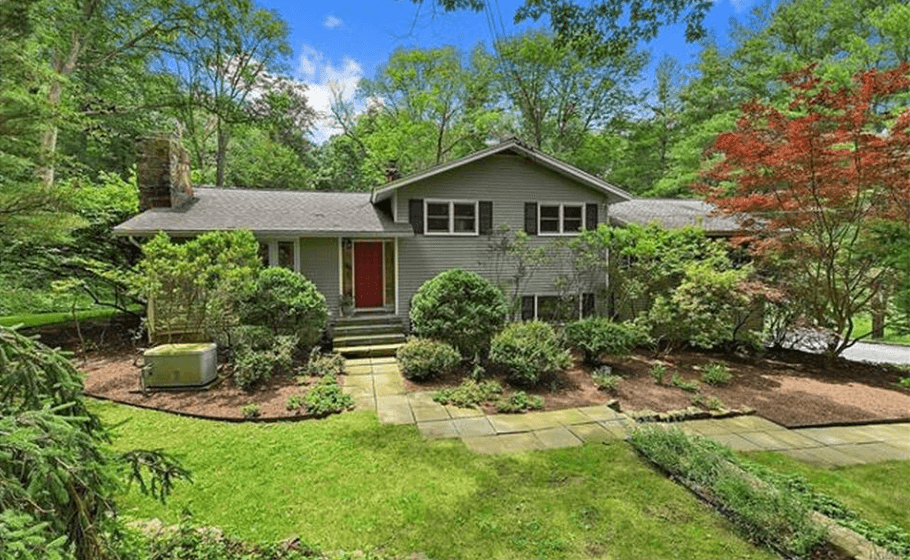 This $820,000 Bedford house has a large backyard—and some impressive neighbors