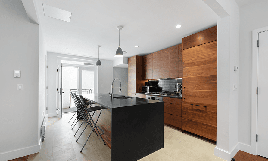 This renovated East Village townhouse comes with a lifetime tenant in tow