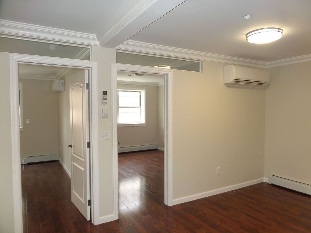 This LIC two-bedroom is over $1,000 less than the area median. Can you figure out why?