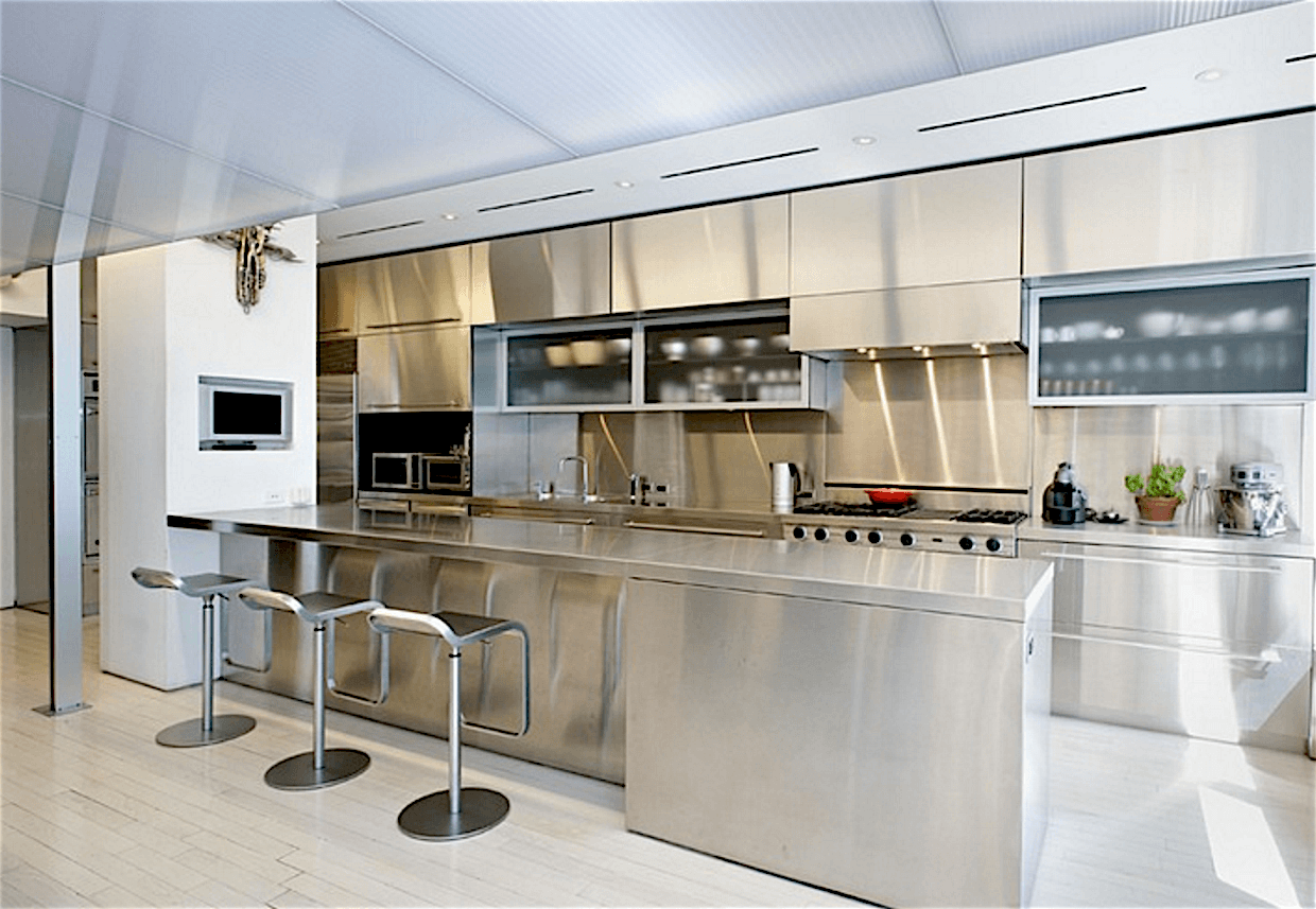 A home with a spotless—and space-enhancing—stainless steel kitchen