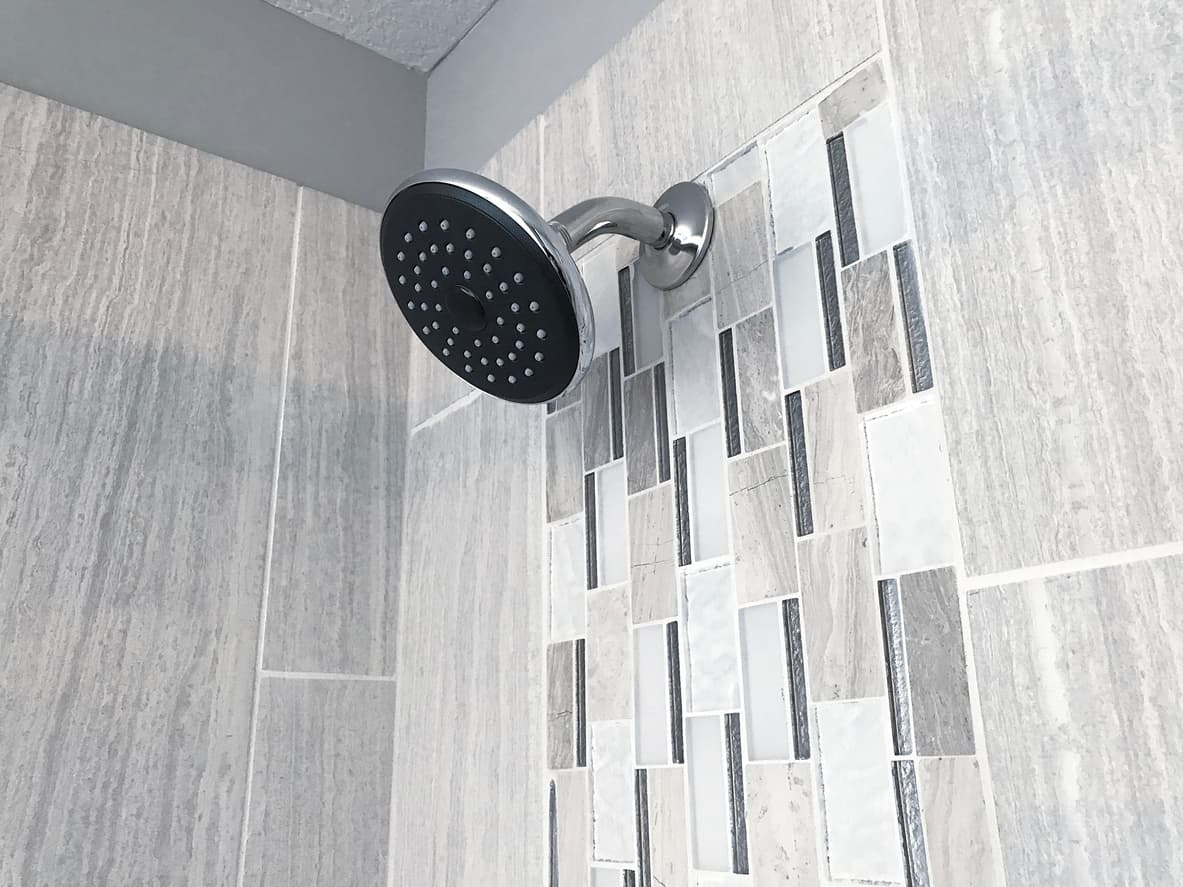 My neighbor's shower flooded my apartment, but his insurance won't cover it. What can I do?