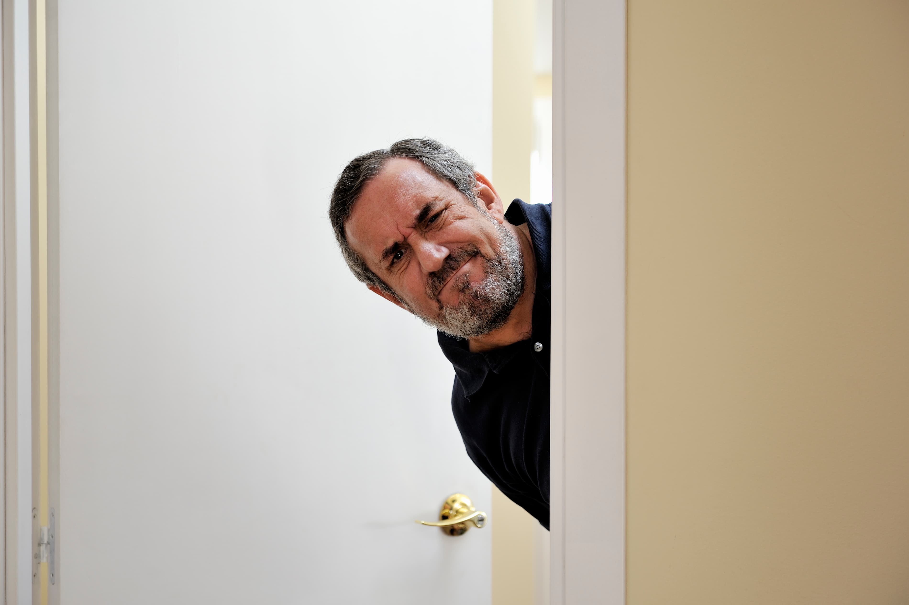 Dear Ms. Demeanor: Someone is graffitiing my door—can I put a camera in the peephole to catch them?