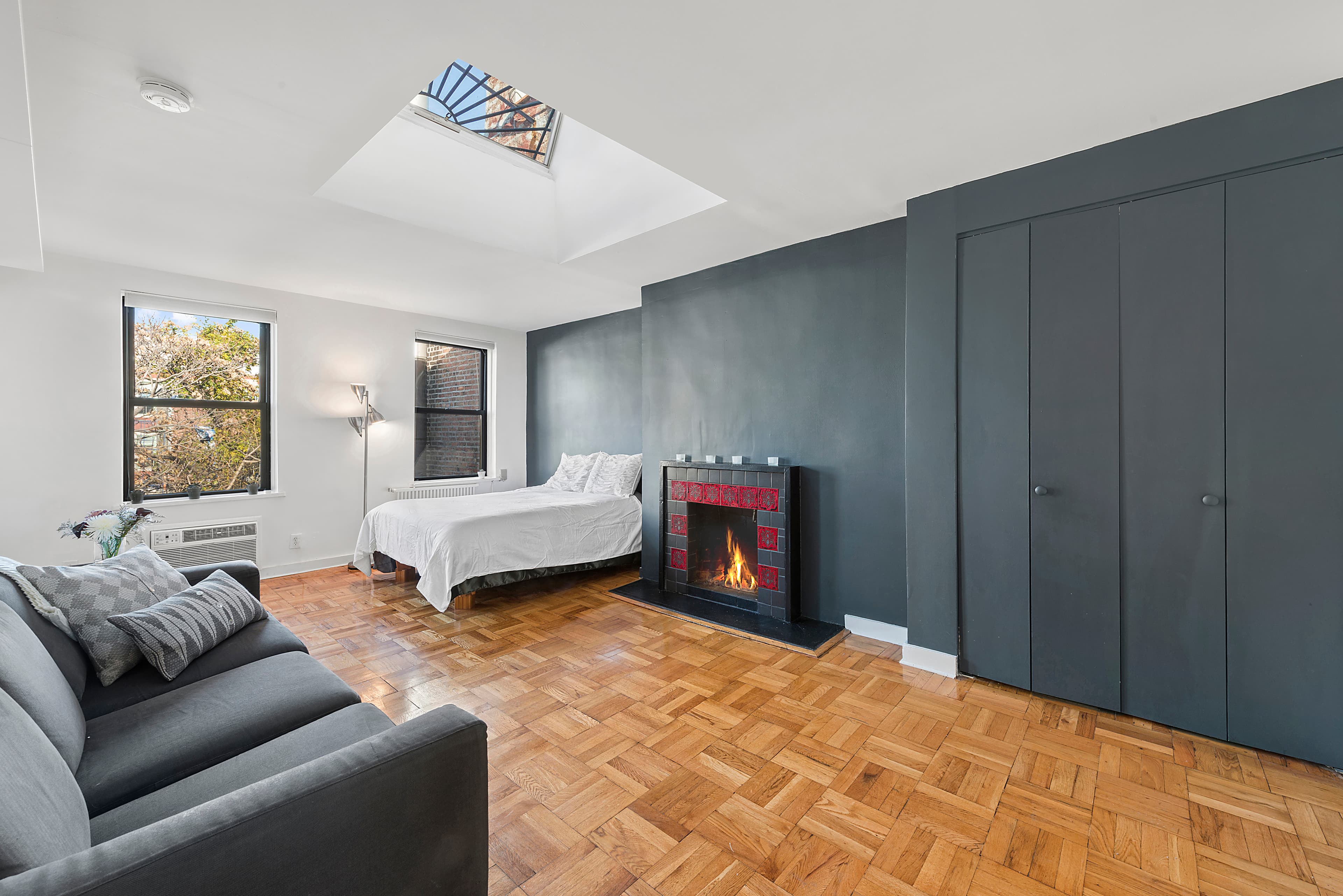 Right on St. Marks Place, this studio features a fireplace, skylight, AND private rooftop terrace