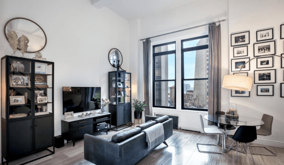 A sleeping loft gives this Financial District studio plenty of space for entertaining