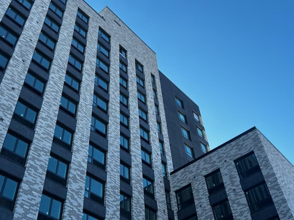 A photo of the top of 475 Bay Street, a 12-story affordable housing development in Staten Island.
