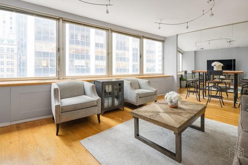 This Wall Street area one bedroom has a wall of windows 